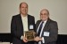 Prof. Rolf Dornberger receiving from Dr. Nagib Callaos, on behalf of Dr. Michael von Kutzschenbach, a plaque "In Appreciation for Delivering a Great Keynote Address at a Plenary Session."